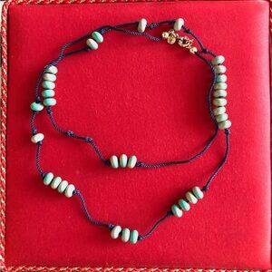 J. Crew factory necklace, green/natural needs with blue thread, golden hardware.